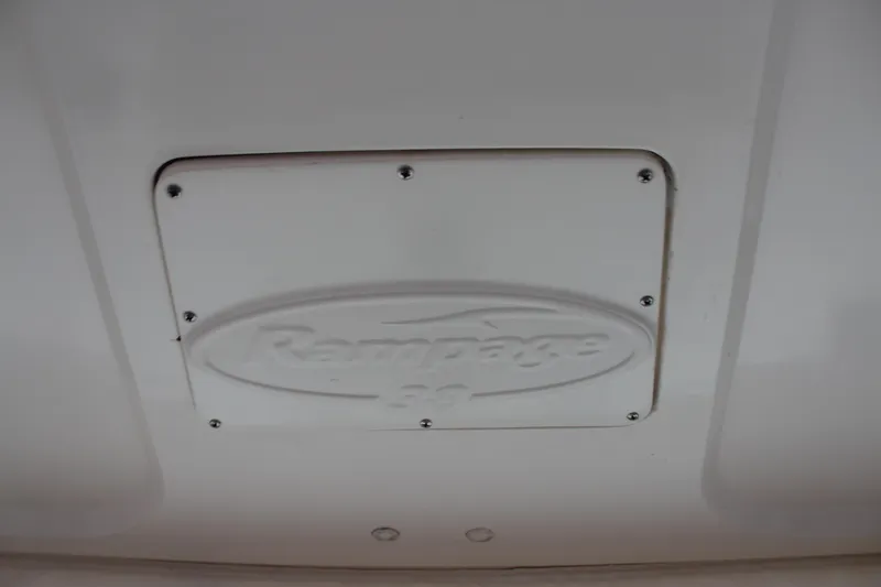 Holly Ann Yacht Photos Pics 2005 Rampage 38 Express logo on a white panel with screws.