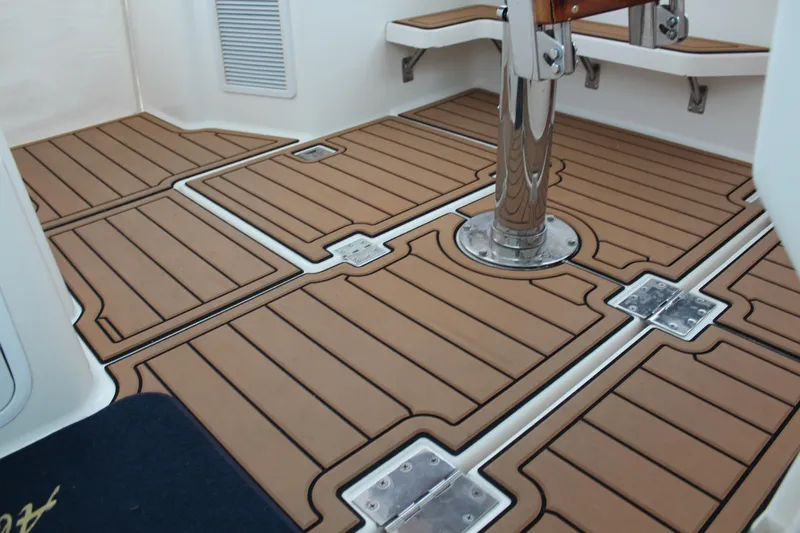 Holly Ann Yacht Photos Pics 2005 Rampage 38 Express boat deck with teak-style flooring and metal fixtures.
