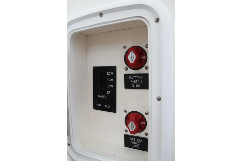 Holly Ann Yacht Photos Pics Control panel of a 2005 Rampage 38 Express boat with battery switches and labels.