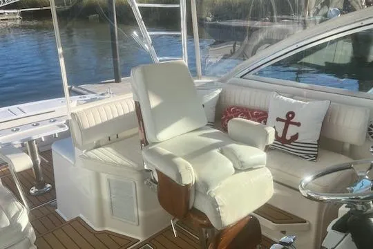 Holly Ann Yacht Photos Pics Luxurious 2005 Rampage 38 Express yacht interior with plush seating and nautical decor.