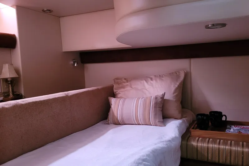  Yacht Photos Pics Cozy interior of 2007 Meridian 341 Sedan with plush bedding and elegant decor.