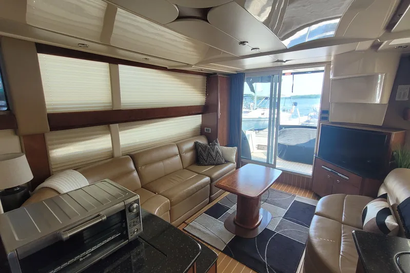  Yacht Photos Pics Luxurious interior of a 2007 Meridian 341 Sedan yacht with leather seating and modern amenities.
