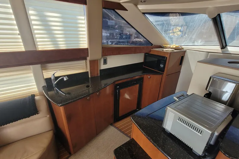  Yacht Photos Pics Luxurious 2007 Meridian 341 Sedan yacht interior with modern kitchen amenities.