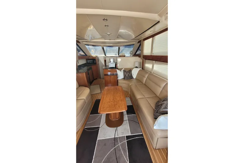  Yacht Photos Pics Luxurious interior of a 2007 Meridian 341 Sedan yacht with leather seating and wooden accents.