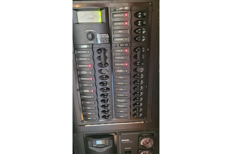  Yacht Photos Pics Electrical panel of a 2007 Meridian 341 Sedan boat with various switches and indicators.