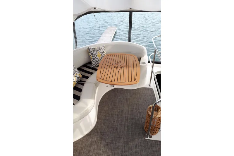  Yacht Photos Pics Luxurious 2007 Meridian 341 Sedan yacht interior with elegant seating and wooden table.
