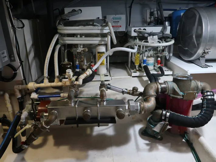 North Star Yacht Photos Pics Engine room of a 2009 Wesmac 44' yacht with complex piping.