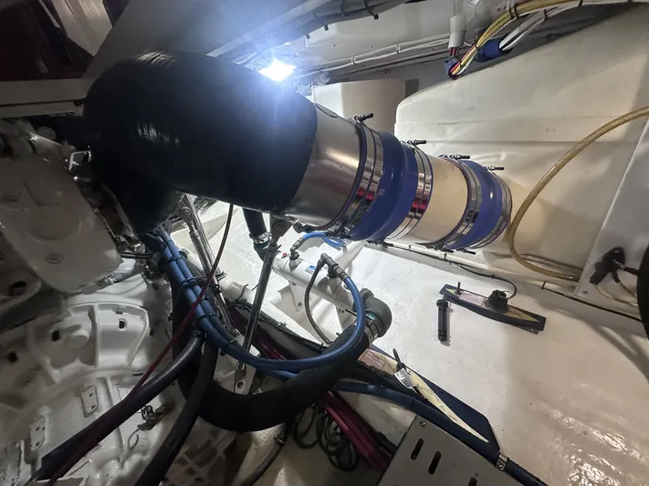 North Star Yacht Photos Pics Engine room of a 2009 Wesmac 44' boat with hoses and pipes.