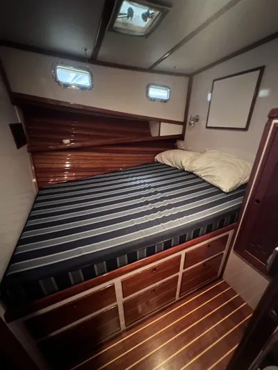 North Star Yacht Photos Pics Interior of a 2009 Wesmac 44' yacht featuring a cozy bed.