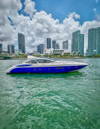  Yacht Photos Pics 2005 Azimut Atlantis 55 yacht cruising in urban waterfront with skyscrapers in background.