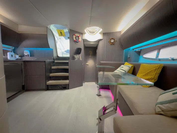  Yacht Photos Pics Interior of 2005 Azimut Atlantis 55 yacht with modern seating and glass table.