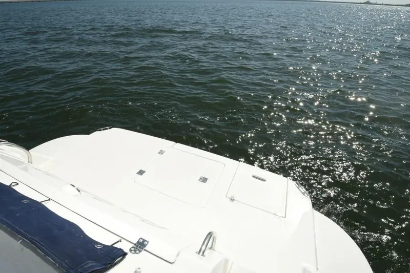 Time 'n Material Yacht Photos Pics 2007 Cruisers Yachts 420 Express on calm water, rear deck view.
