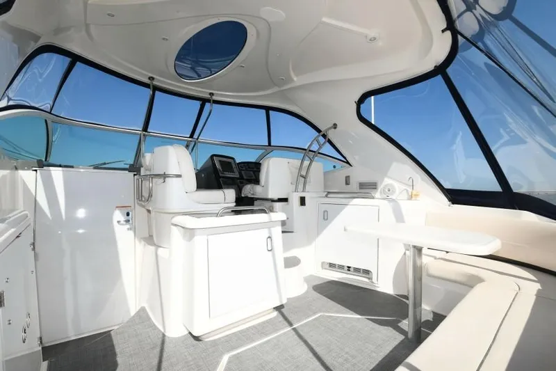 Time 'n Material Yacht Photos Pics 2007 Cruisers Yachts 420 Express interior with helm, seating, and panoramic windows.