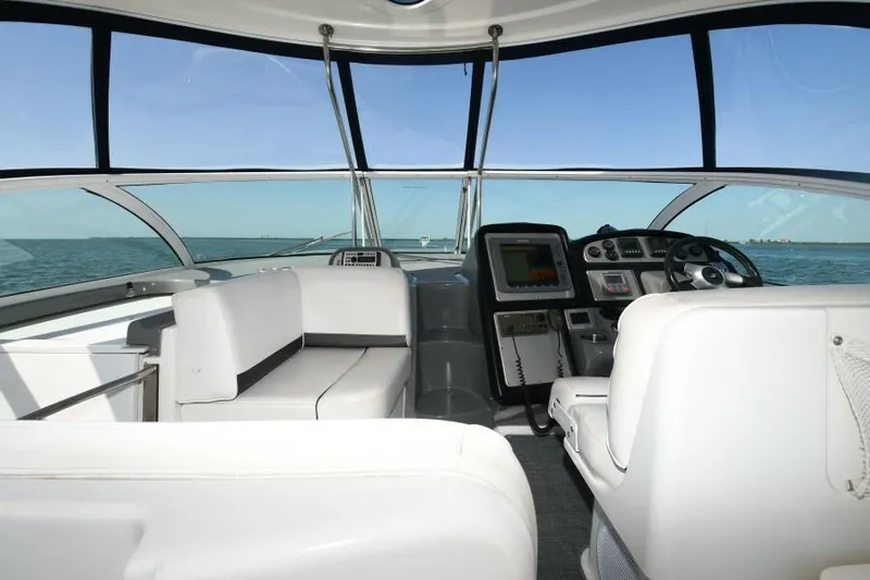 Time 'n Material Yacht Photos Pics 2007 Cruisers Yachts 420 Express interior with white seating and navigation controls.