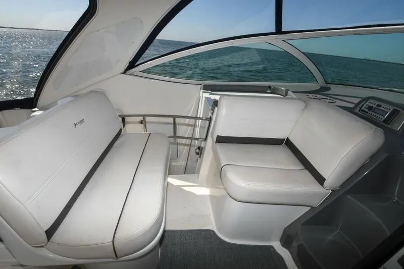 Time 'n Material Yacht Photos Pics 2007 Cruisers Yachts 420 Express interior with white seating and ocean view.