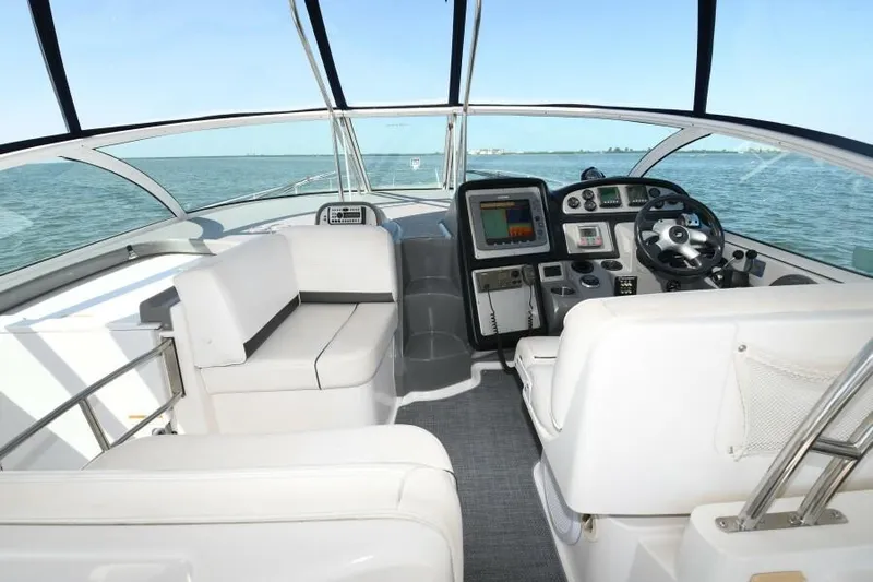 Time 'n Material Yacht Photos Pics 2007 Cruisers Yachts 420 Express cockpit with modern controls and ocean view.