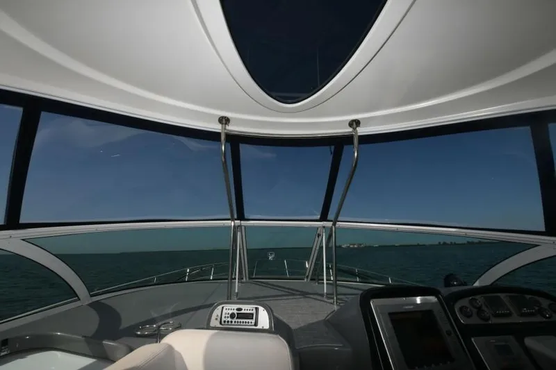 Time 'n Material Yacht Photos Pics Interior view of 2007 Cruisers Yachts 420 Express, showcasing helm and panoramic windows.