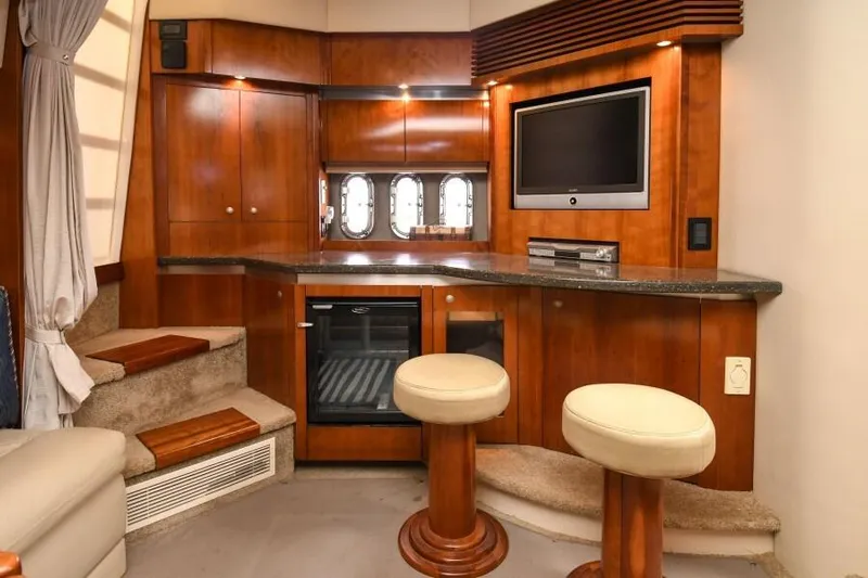 Time 'n Material Yacht Photos Pics Luxurious 2007 Cruisers Yachts 420 Express interior with wood cabinetry and modern amenities.
