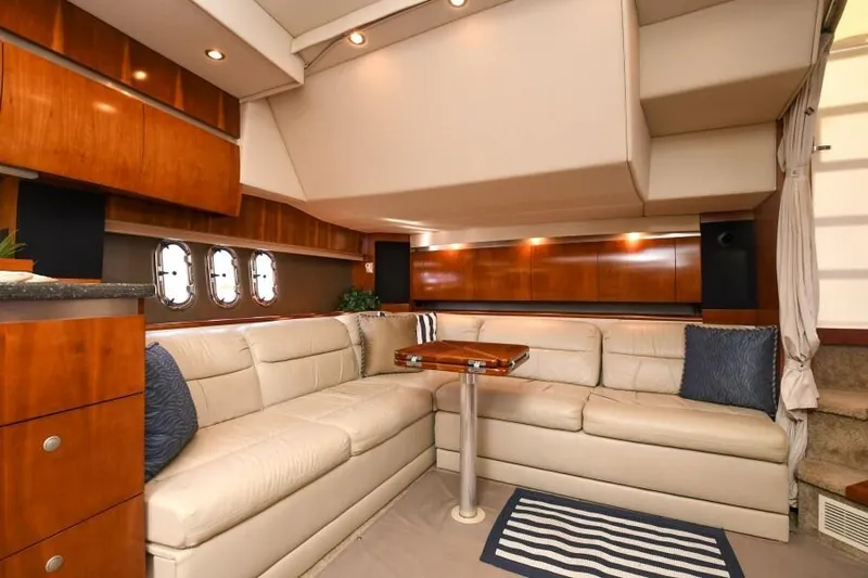 Time 'n Material Yacht Photos Pics Luxurious interior of 2007 Cruisers Yachts 420 Express with leather seating and wooden accents.