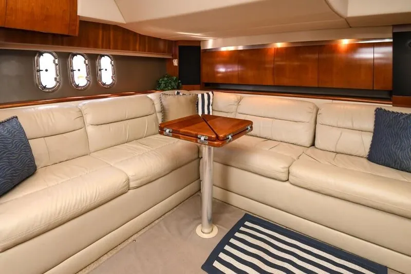 Time 'n Material Yacht Photos Pics Luxurious interior of 2007 Cruisers Yachts 420 Express with leather seating and wooden accents.