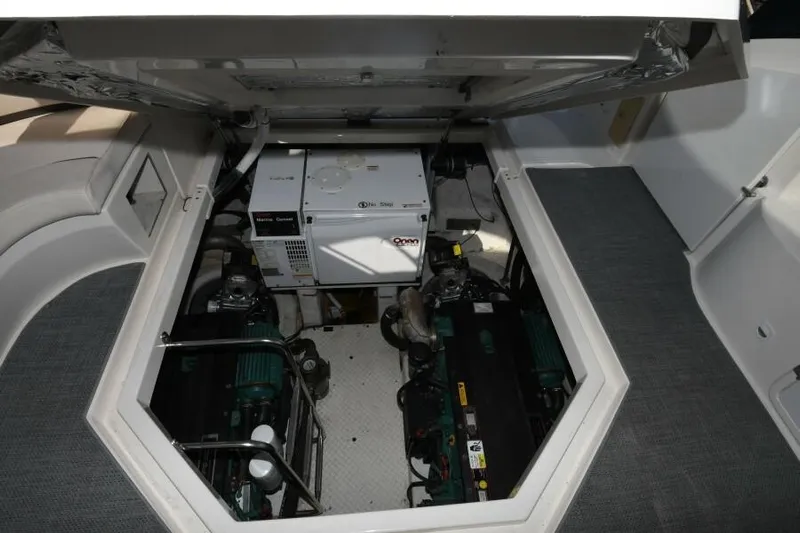 Time 'n Material Yacht Photos Pics Engine compartment of 2007 Cruisers Yachts 420 Express, showcasing dual engines and generator.