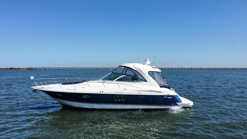 Time 'n Material Yacht Photos Pics 2007 Cruisers Yachts 420 Express on open water under clear blue sky.