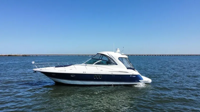 Time 'n Material Yacht Photos Pics 2007 Cruisers Yachts 420 Express on open water under clear blue sky.
