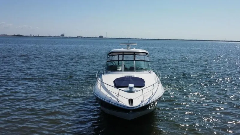 Time 'n Material Yacht Photos Pics 2007 Cruisers Yachts 420 Express on calm water, front view.