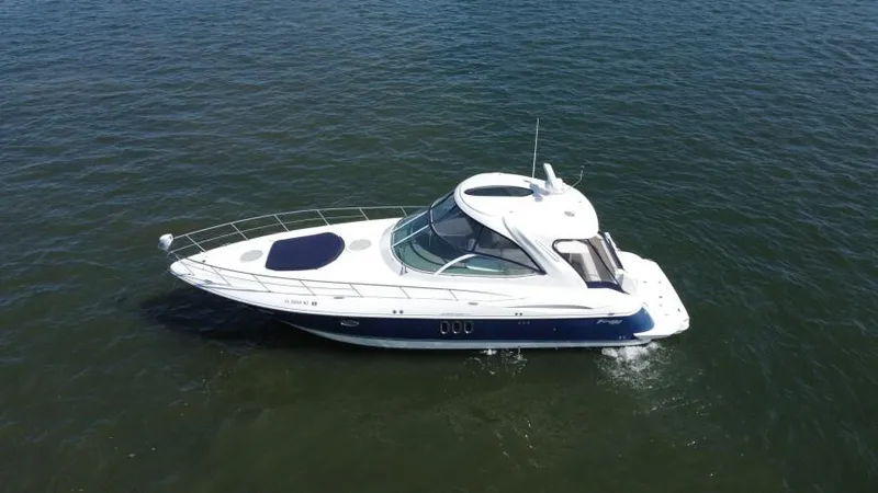 Time 'n Material Yacht Photos Pics 2007 Cruisers Yachts 420 Express on open water, side view.