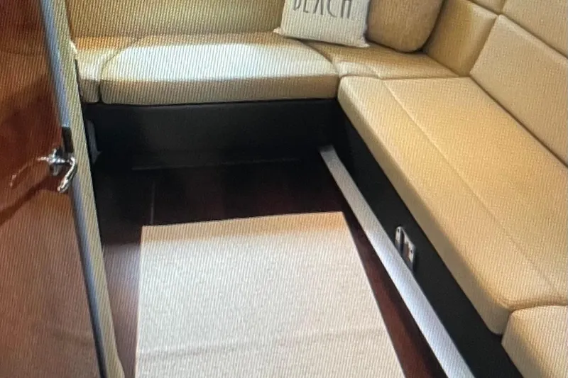 River Time Yacht Photos Pics Interior of 2012 Regal 35 Sport Coupe with beige seating and wooden flooring.