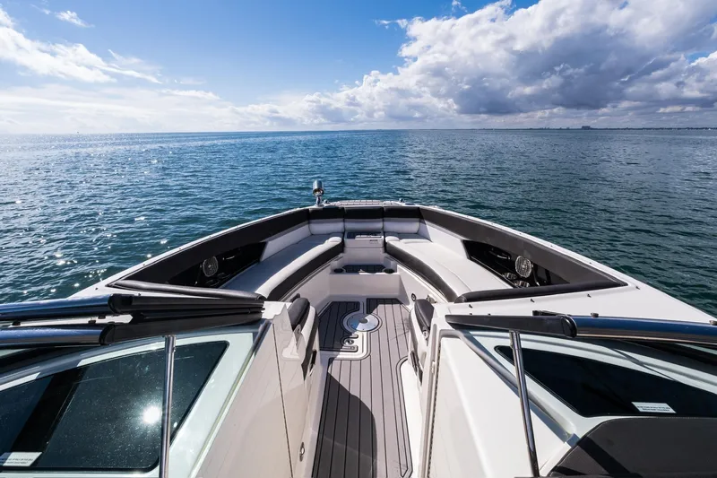 Dock's Knott Inn II Yacht Photos Pics 2018 Sea Ray SLX 350 Outboard cruising on open water under a partly cloudy sky.