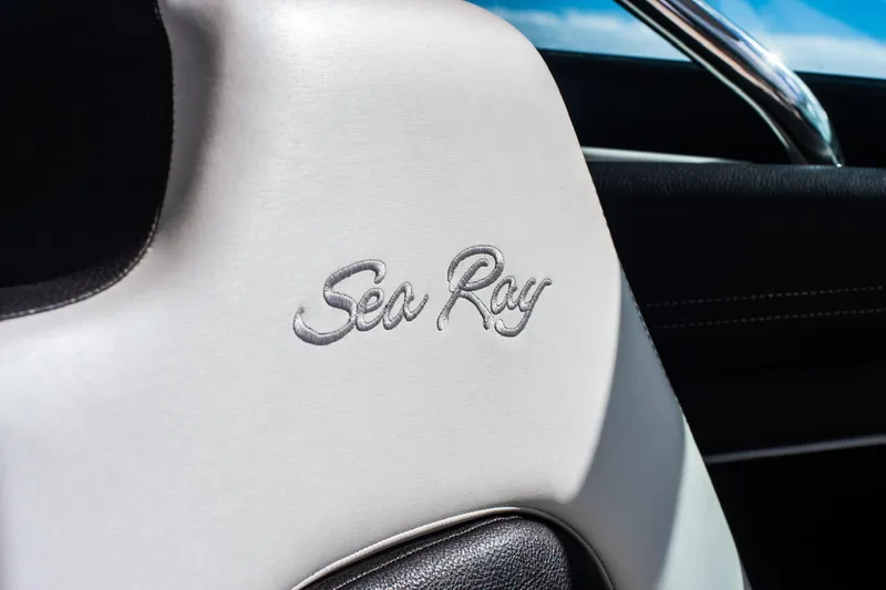 Dock's Knott Inn II Yacht Photos Pics Close-up of Sea Ray logo on 2018 SLX 350 Outboard boat seat.