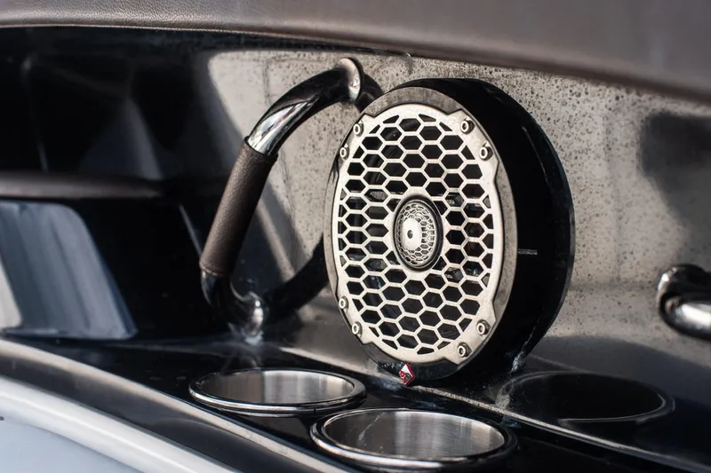 Dock's Knott Inn II Yacht Photos Pics Speaker and cup holders on 2018 Sea Ray SLX 350 Outboard boat interior.