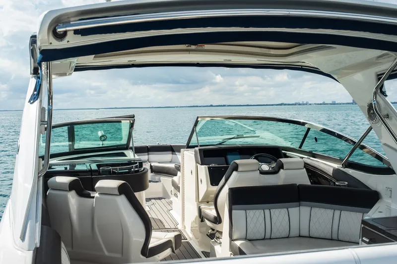 Dock's Knott Inn II Yacht Photos Pics 2018 Sea Ray SLX 350 Outboard boat interior with luxurious seating on open water.