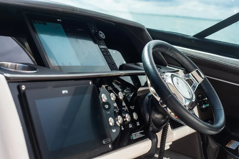 Dock's Knott Inn II Yacht Photos Pics 2018 Sea Ray SLX 350 Outboard dashboard with steering wheel and digital displays.