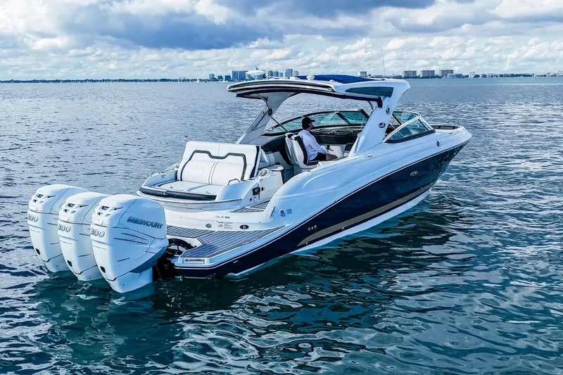 Dock's Knott Inn II Yacht Photos Pics 2018 Sea Ray SLX 350 Outboard cruising on open water under a cloudy sky.