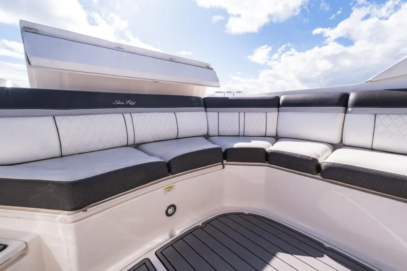 Dock's Knott Inn II Yacht Photos Pics Luxurious seating on 2018 Sea Ray SLX 350 Outboard boat under blue sky.