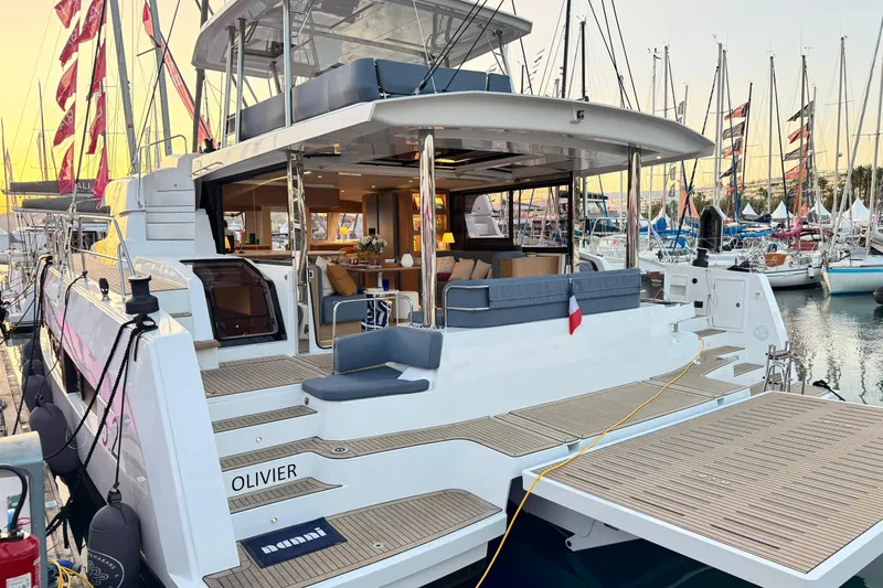  Yacht Photos Pics Luxurious 2026 Bali 5.2 yacht docked at marina, showcasing elegant design and spacious deck.