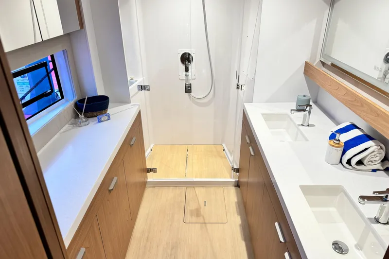  Yacht Photos Pics Modern bathroom interior in 2026 Bali 5.2 yacht, featuring dual sinks and spacious shower.