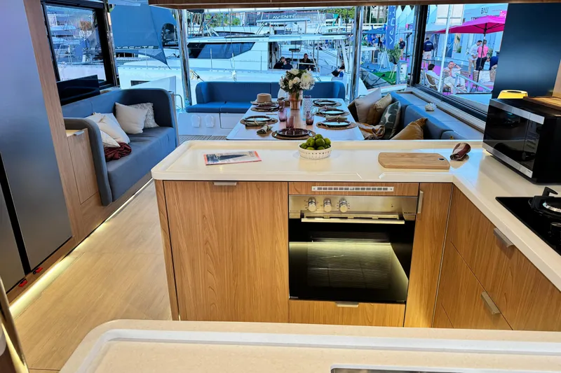  Yacht Photos Pics Luxurious interior of 2026 Bali 5.2 yacht with modern kitchen and dining area.