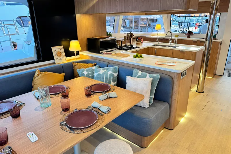  Yacht Photos Pics Luxurious interior of 2026 Bali 5.2 yacht with elegant dining and kitchen area.