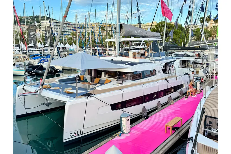  Yacht Photos Pics 2026 Bali 5.2 catamaran docked at marina with vibrant pink walkway.