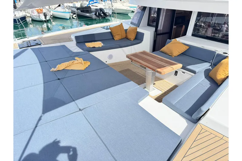  Yacht Photos Pics Luxurious Bali 5.2 yacht deck with blue seating and yellow cushions, 2026 model.