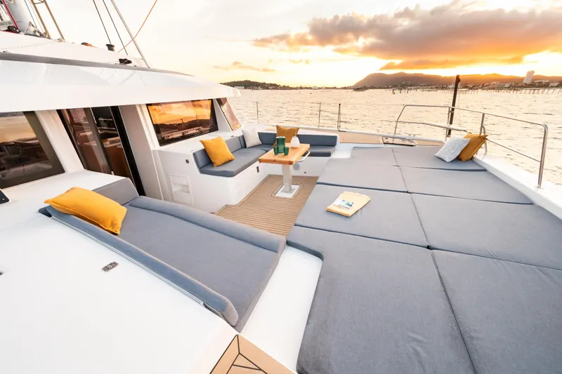  Yacht Photos Pics Luxurious Bali 5.2 yacht deck with sunset view, featuring spacious seating and elegant design, 2026 model.