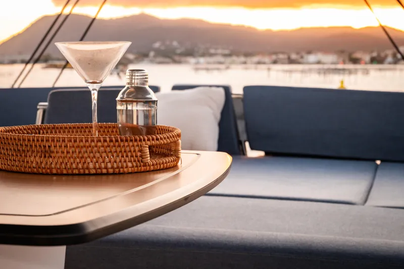  Yacht Photos Pics Luxurious Bali 5.2 yacht interior with cocktail setup at sunset, 2026 model.