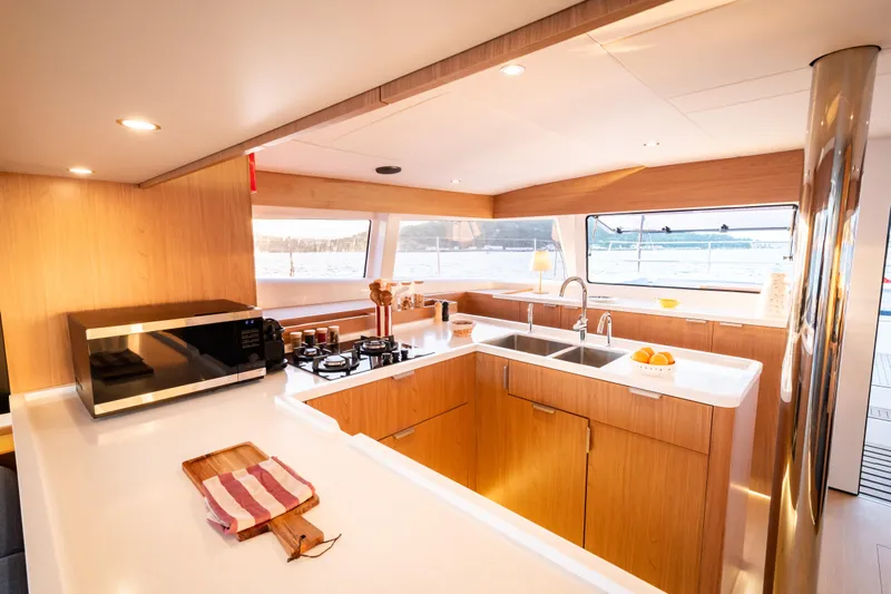  Yacht Photos Pics Modern kitchen interior on 2026 Bali 5.2 yacht, featuring sleek design and ocean view.