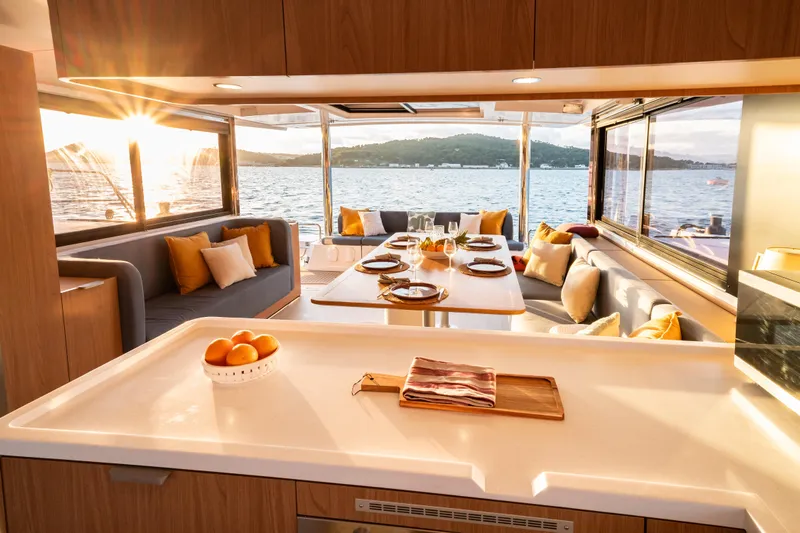  Yacht Photos Pics Luxurious Bali 5.2 yacht interior with elegant dining area, sunset view, and modern design, 2026 model.