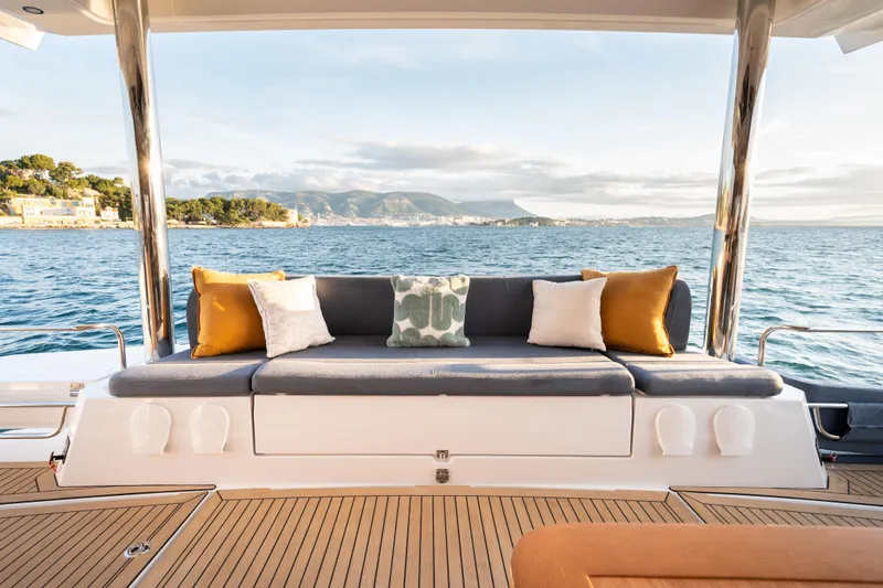  Yacht Photos Pics Luxurious Bali 5.2 yacht interior with plush seating, ocean view, and decorative cushions, 2026 model.