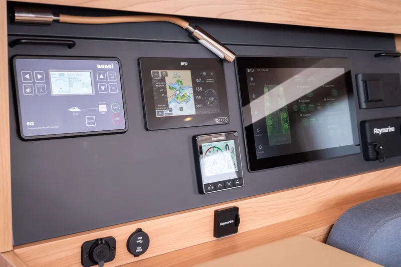  Yacht Photos Pics Control panel of a 2026 Bali 5.2 yacht with navigation and monitoring screens.