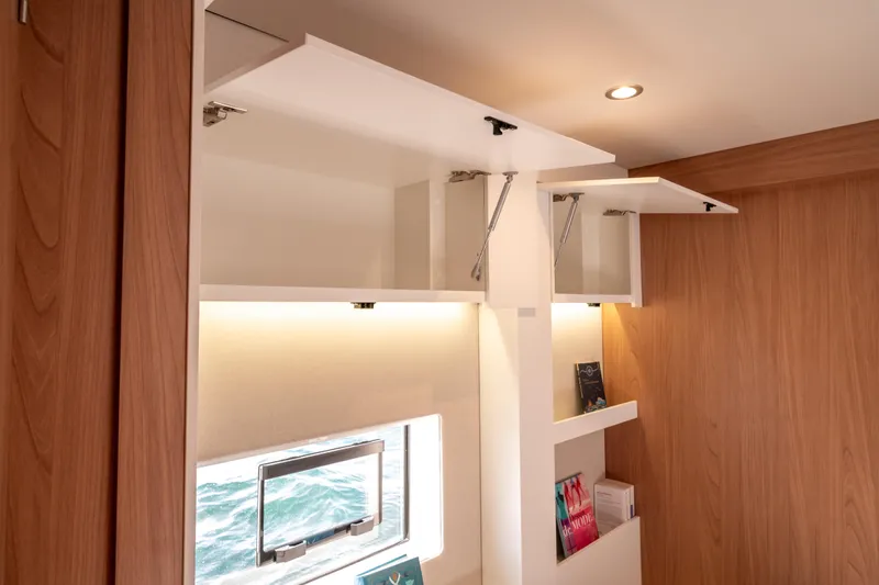  Yacht Photos Pics Modern interior of Bali 5.2 yacht, featuring open cabinets and sleek wood paneling, 2026 model.